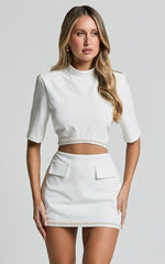 Jaden Two Piece Set - High Neck Crop Top and Pearl Trim Detail Mini Skirt Set in White